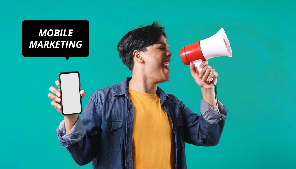 Man with a megaphone and holding up a smartphone, and text that reads "mobile marketing"
